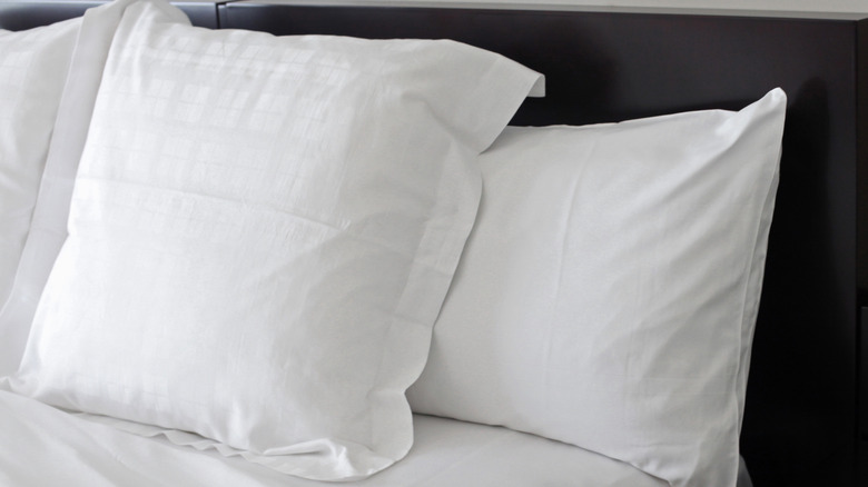 beautiful bed with clean pillows