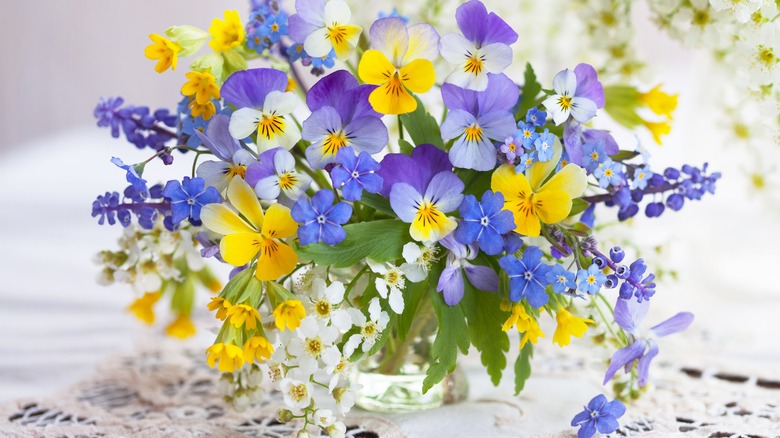 Purple and yellow spring bouquet in vase