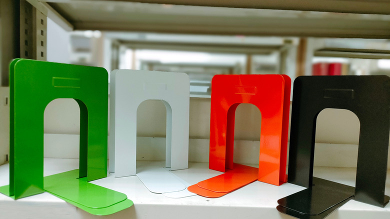 Several different colors of vibrant metal bookends