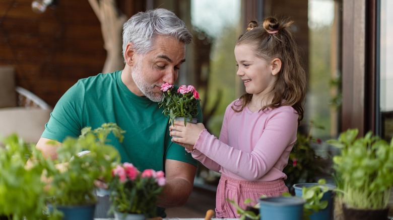 family taking care of plants