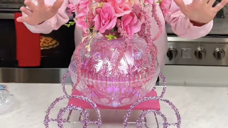 A floral carriage tabletop decoration made entirely from Dollar Tree items and supplies.