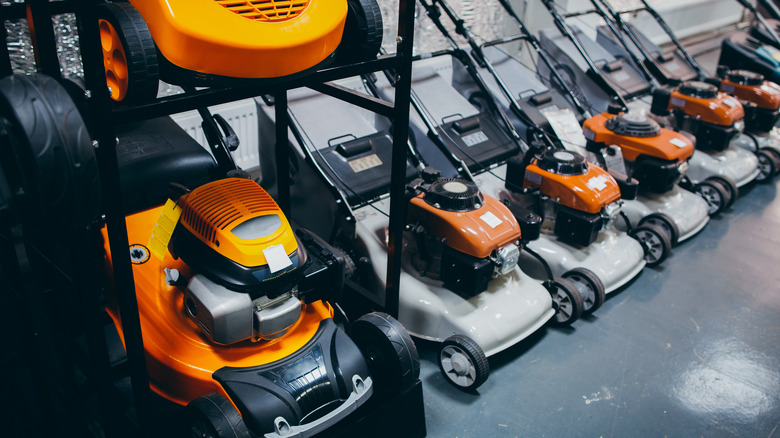 Row of orange lawn mowers 