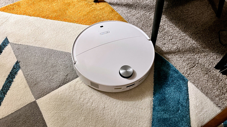 The Roborock Qrevo Edge 3 Pro robot and vacuum cleaner on a thick area rug