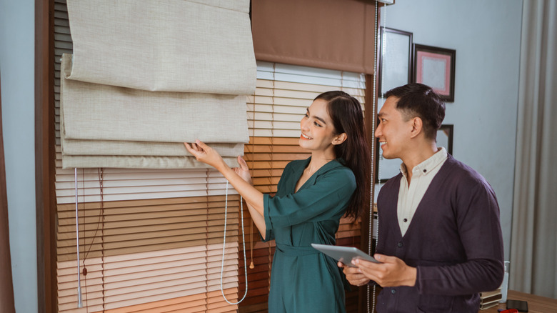 Couple shopping for Roman shades