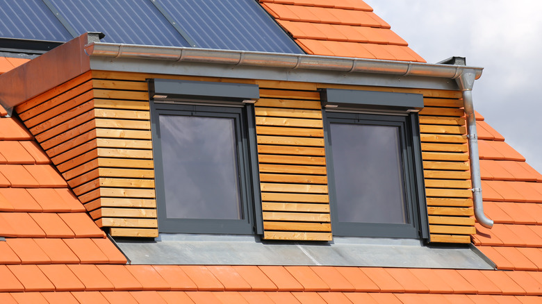 wood-cladded dormer with aluminum flashing