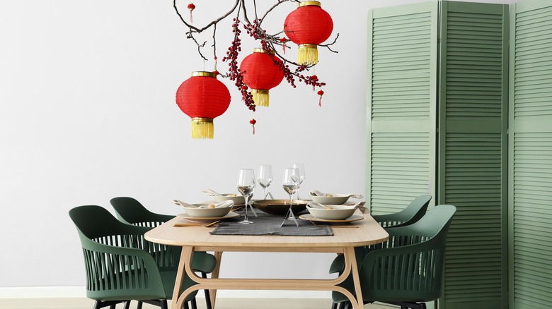 Green chairs around dining table