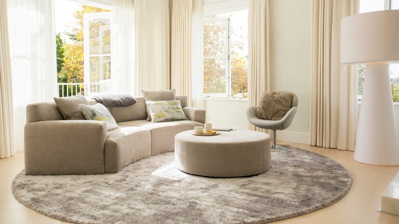 gray round carpet in living room