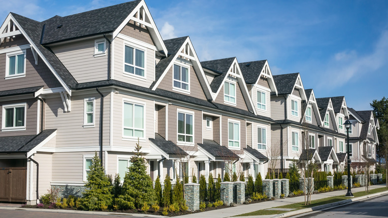 row of siding townhouses