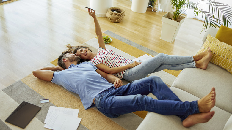 couple lying on rug