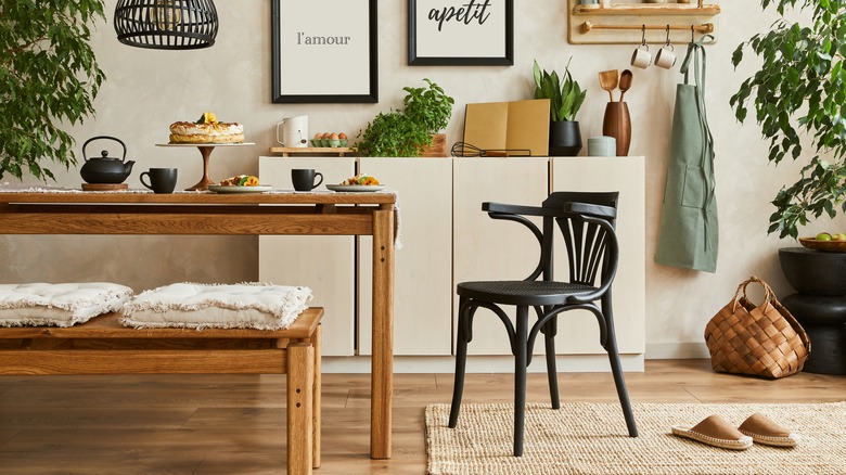 Table, bench, and chair in a kitchen space