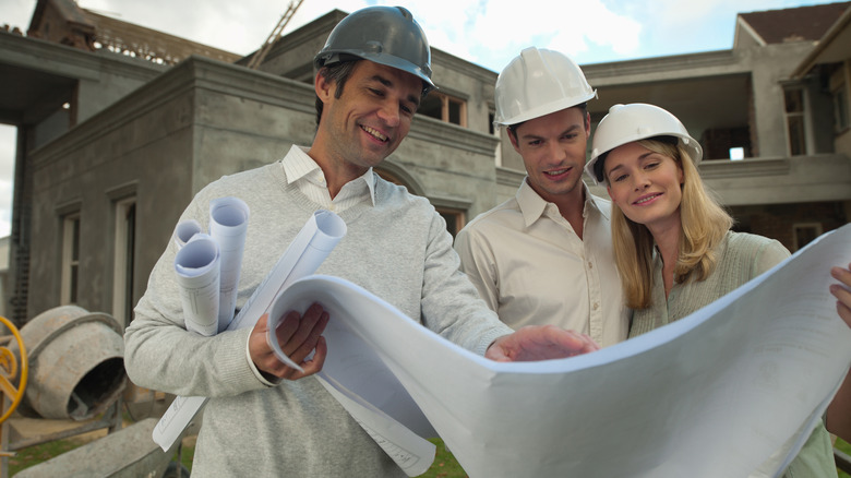 Couple working with an architect 