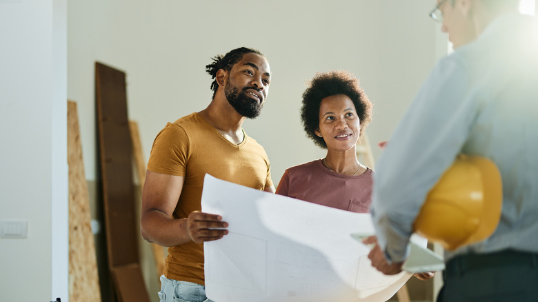 Couple talking to contractor