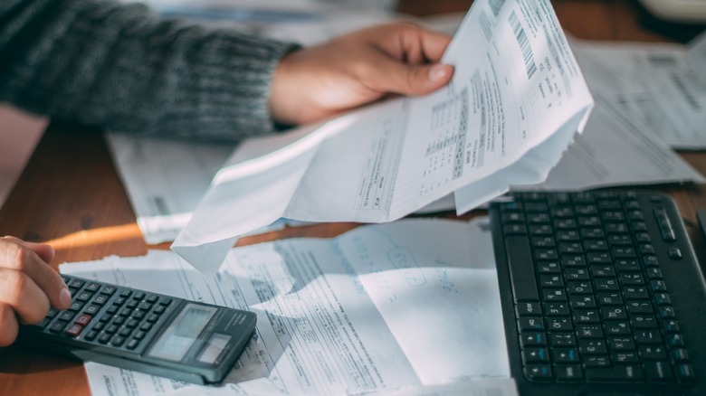 person calculating home building budget