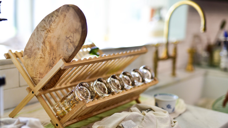 Wooden dish rack next to sink