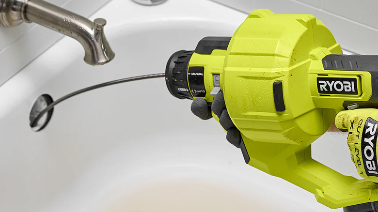 The Ryobi 18V One+ 25' Drain Auger in action