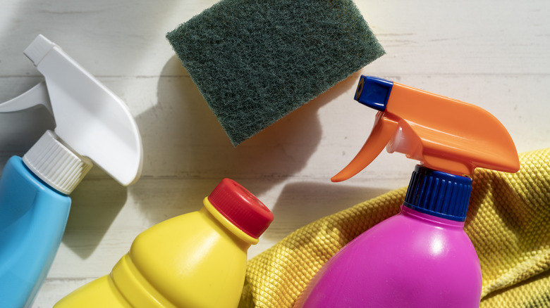 An assortment of cleaning supplies on a table