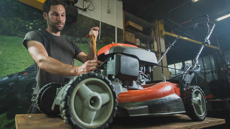 Performing maintenance on lawn mower