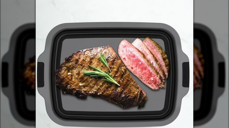 Cuisinart expandable container lid being used to display cooked meat