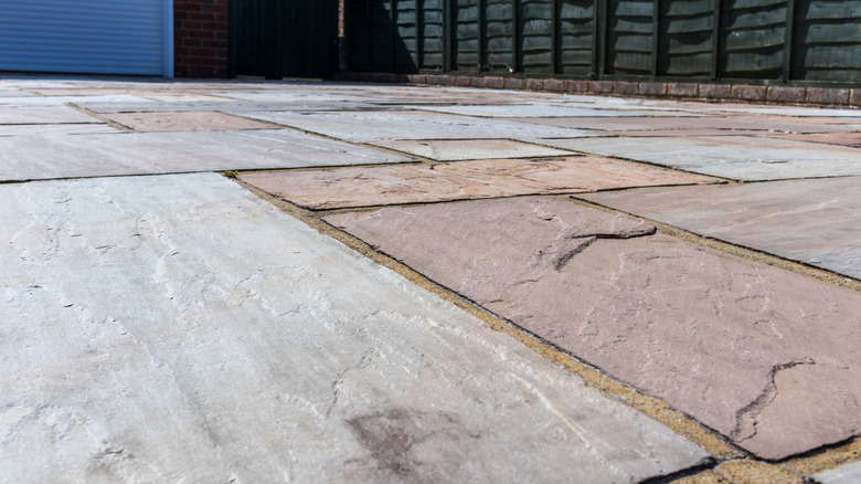 A low angle of textured sandstone pavers used for an outdoor space