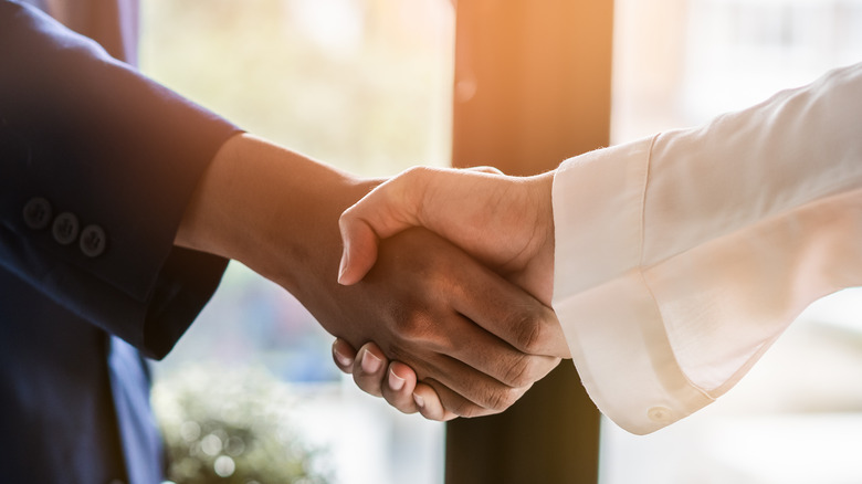 Client and contractor shaking hands 