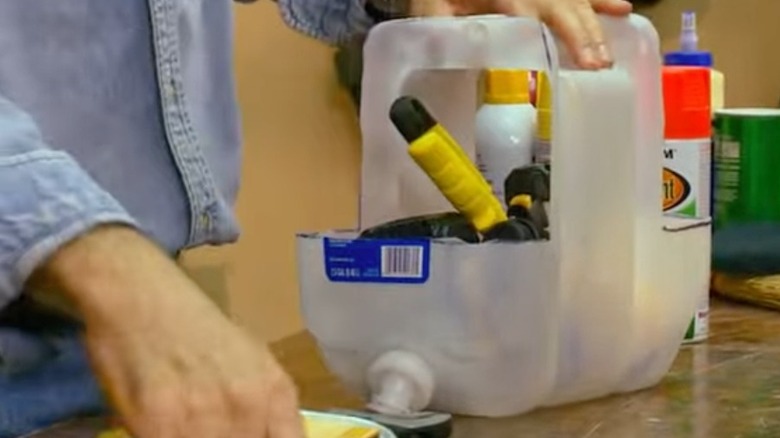 Tool caddy from water jug on worktable
