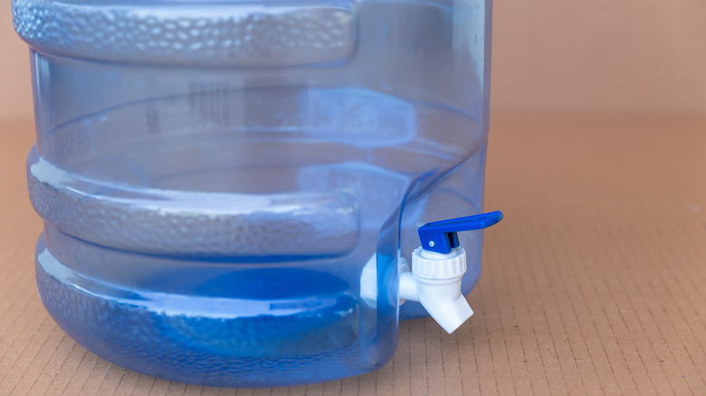 Close up of plastic water jug dispenser