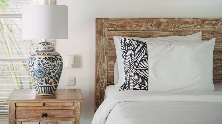 bed with a wooden headboard