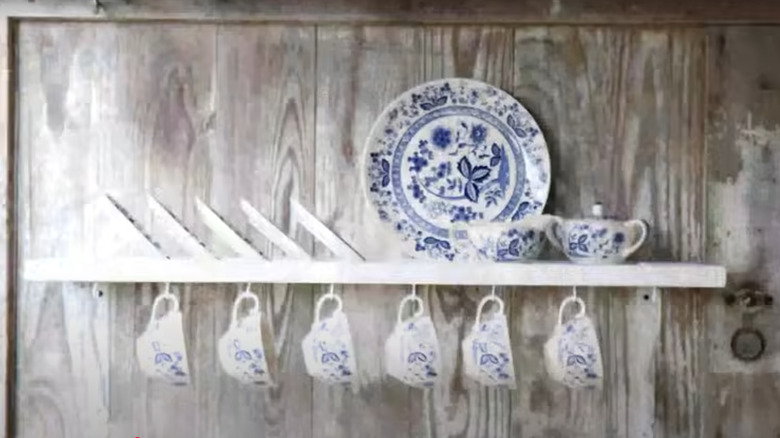 Coffee cup and mug rack made from an old window shutter