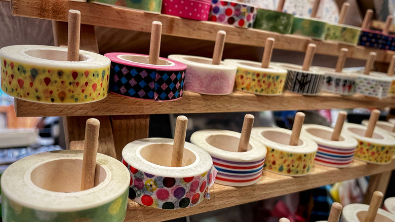 Multiple rolls of washi tape on shelves