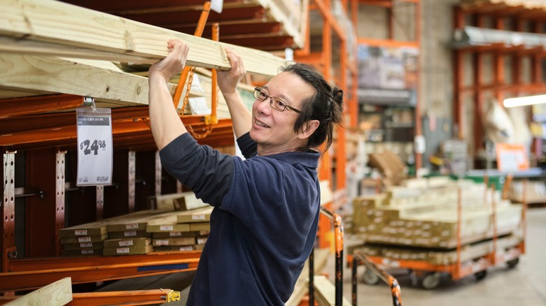 man buying wood