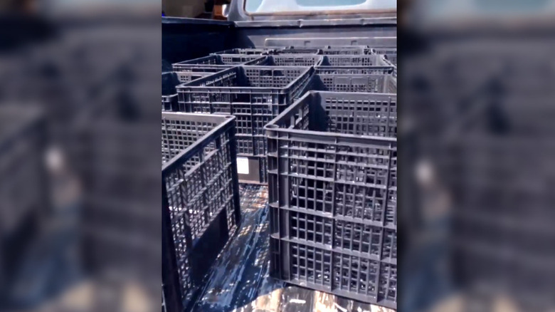 the back of a truck full of crates ready to accept a load of bark