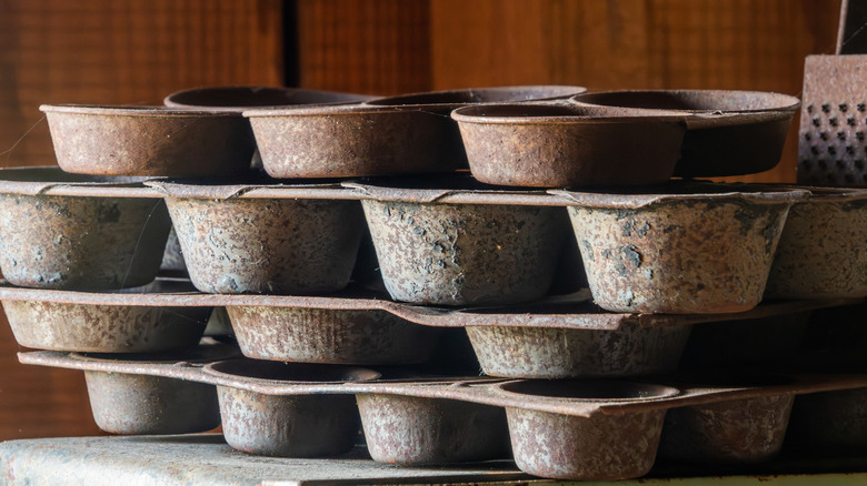 Stack of rusty muffin tins