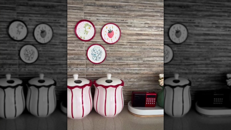 Jar lid wall decor hanging above kitchen canisters