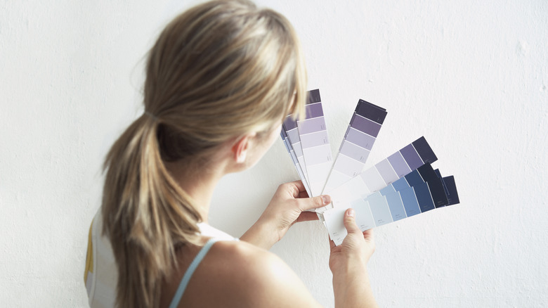 Blonde woman with paint samples
