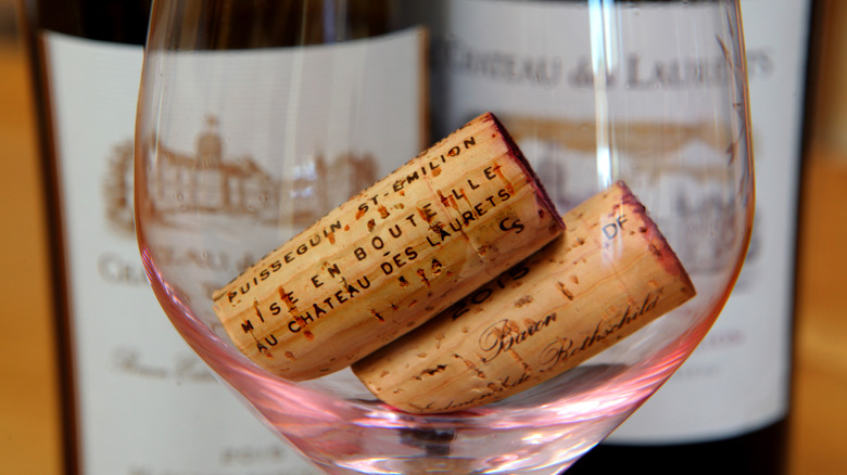 Two wine corks in a wine glass