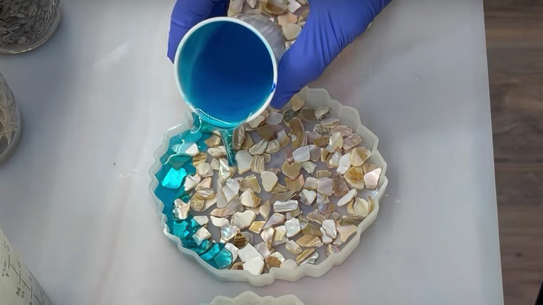 pouring resin into coaster seashell 