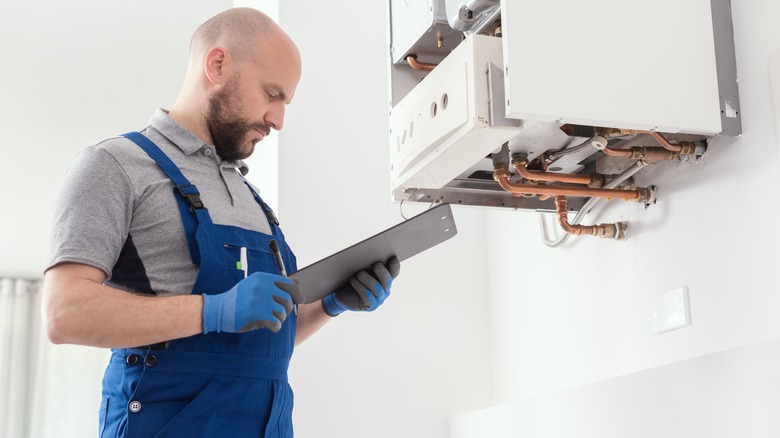 Man inspecting heater