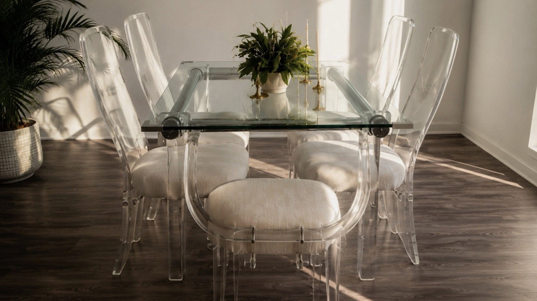 A vintage Lucite dining table and chair set in a modern home