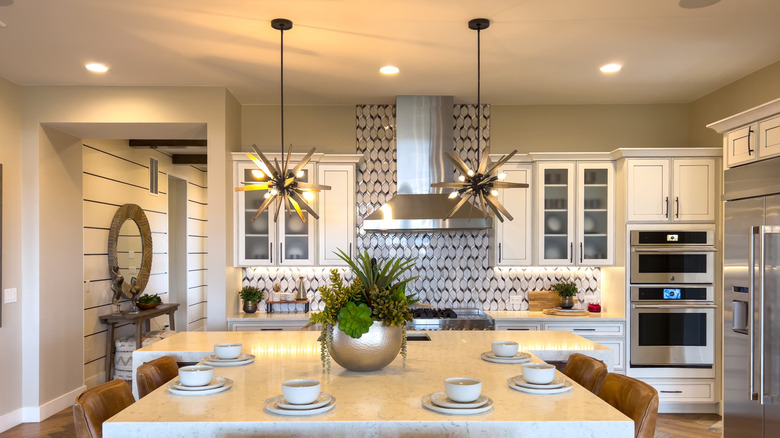 Bright contemporary kitchen with some glass fronted cabinets