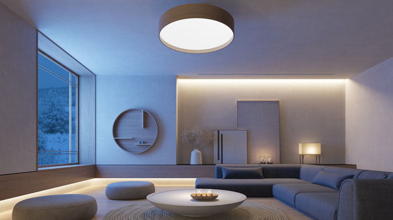 Living room with Japandi interior design, combining Japanese serenity with Scandinavian simplicity. The living room features a muted palette of gray, beige, and light wood tones, creating a tranquil and balanced atmosphere.