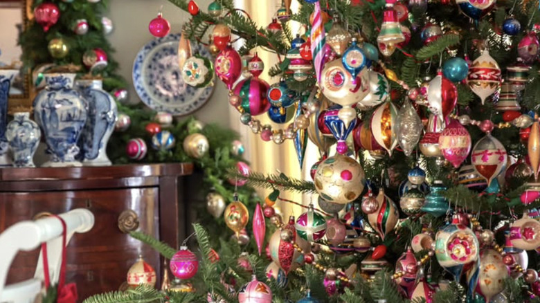 A tree covered in vintage glass ornaments