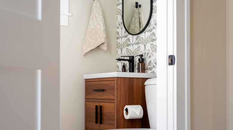Bathroom with wallpaper backsplash