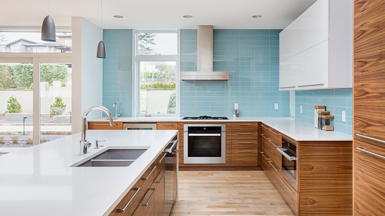 Beautiful kitchen with wood cabinets and light blue backsplash