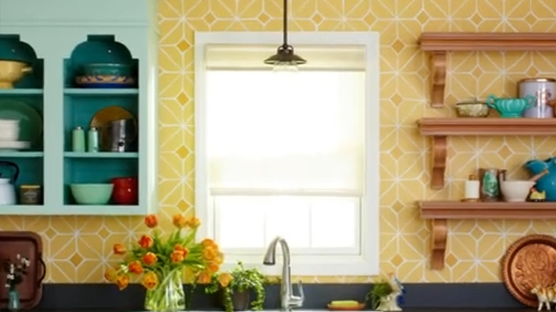 Bright kitchen with yellow painted backsplash