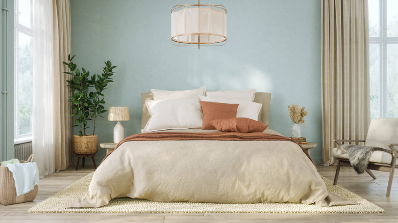 A bedroom featuring a rich blue wall.