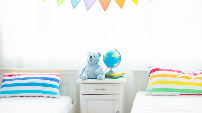 Close-up of twin beds and pillow cases with unique color patterns