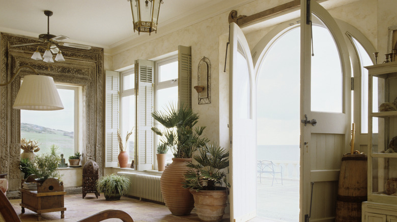 The interior of a 19th century home with bifold wooden shutters.