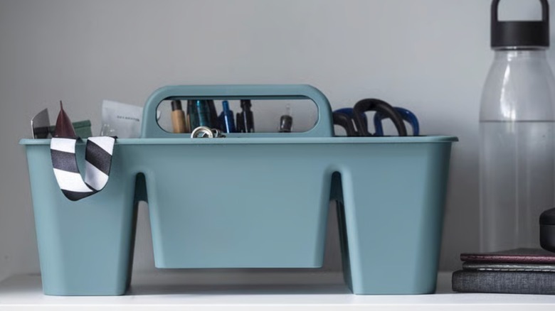 IKEA STACKSTOD holding a variety of items on a counter.