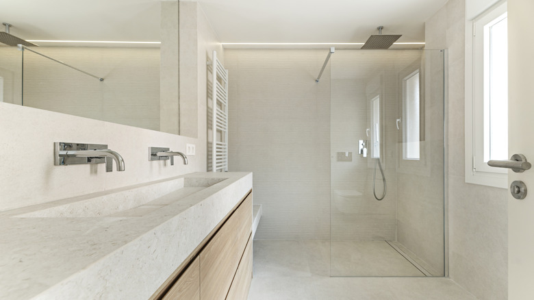 modern bathroom with integrated shower and glass partition