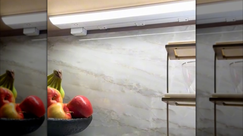 outlet strip attached to upper cabinets